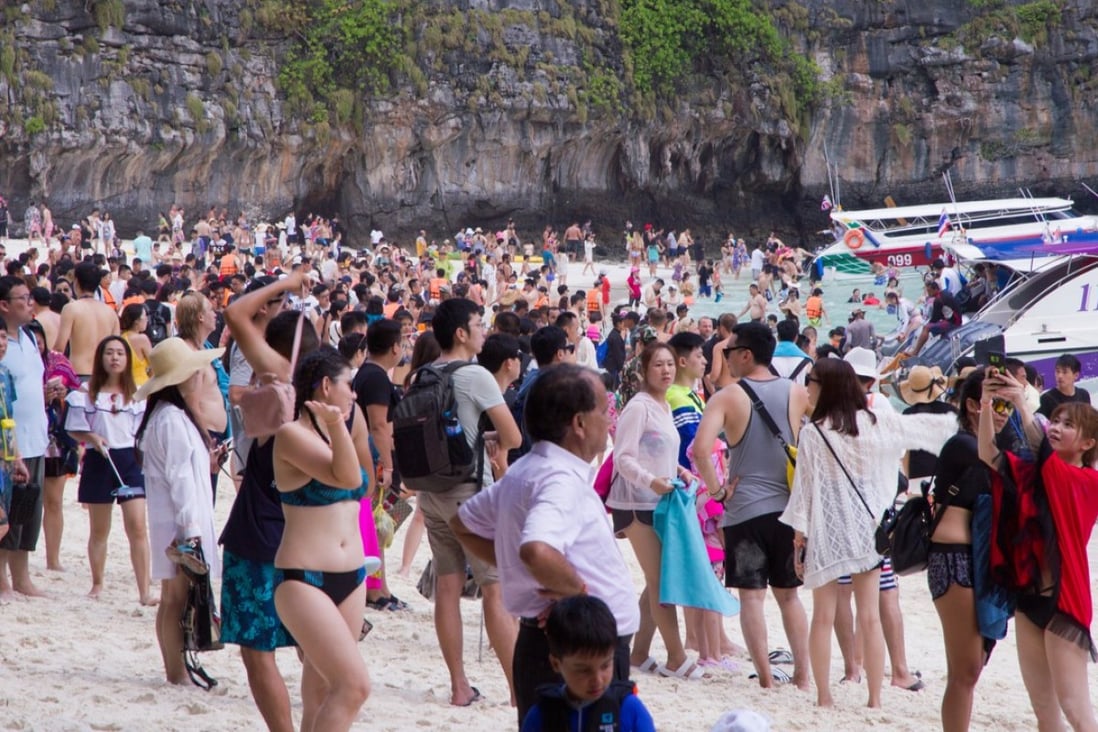 Tourists crowd Maya Bay in Thailand ahead of its closure due to overtourism on June 1.