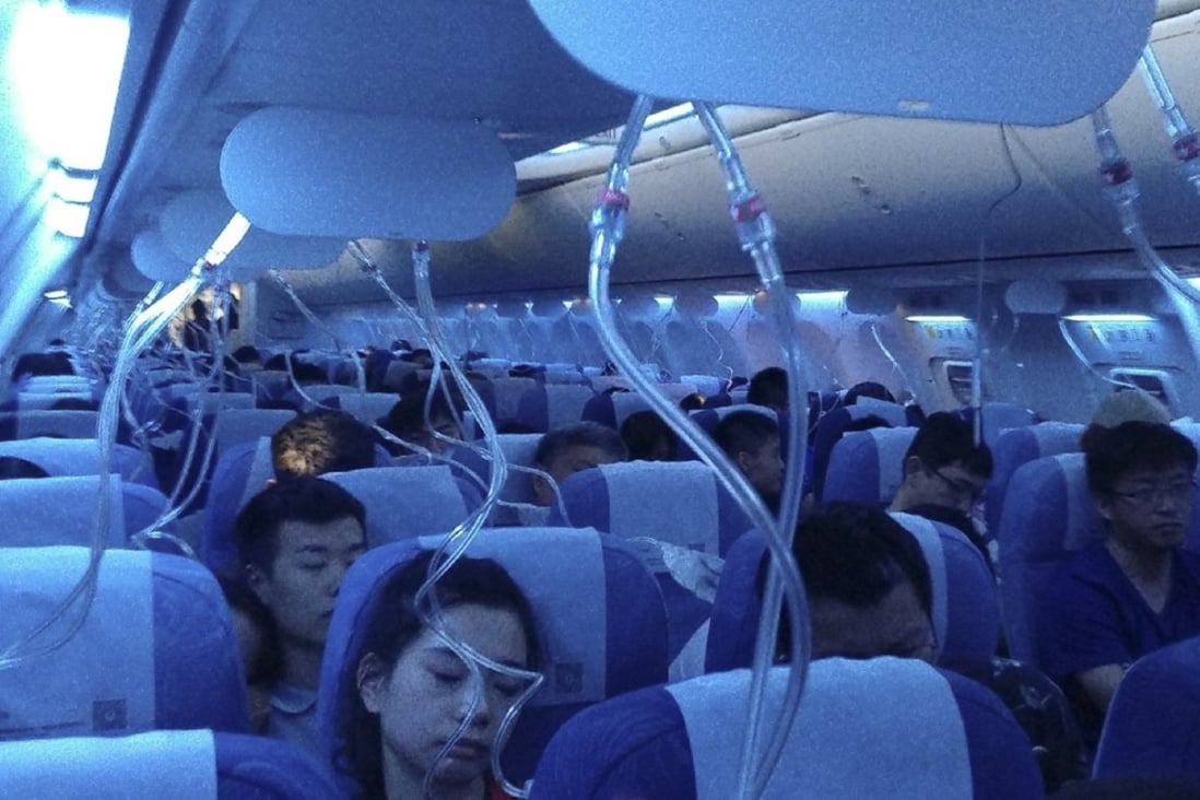 Oxygen masks are deployed aboard Air China flight CA106 from Hong Kong to Dalian in northern China. Photo: Weibo