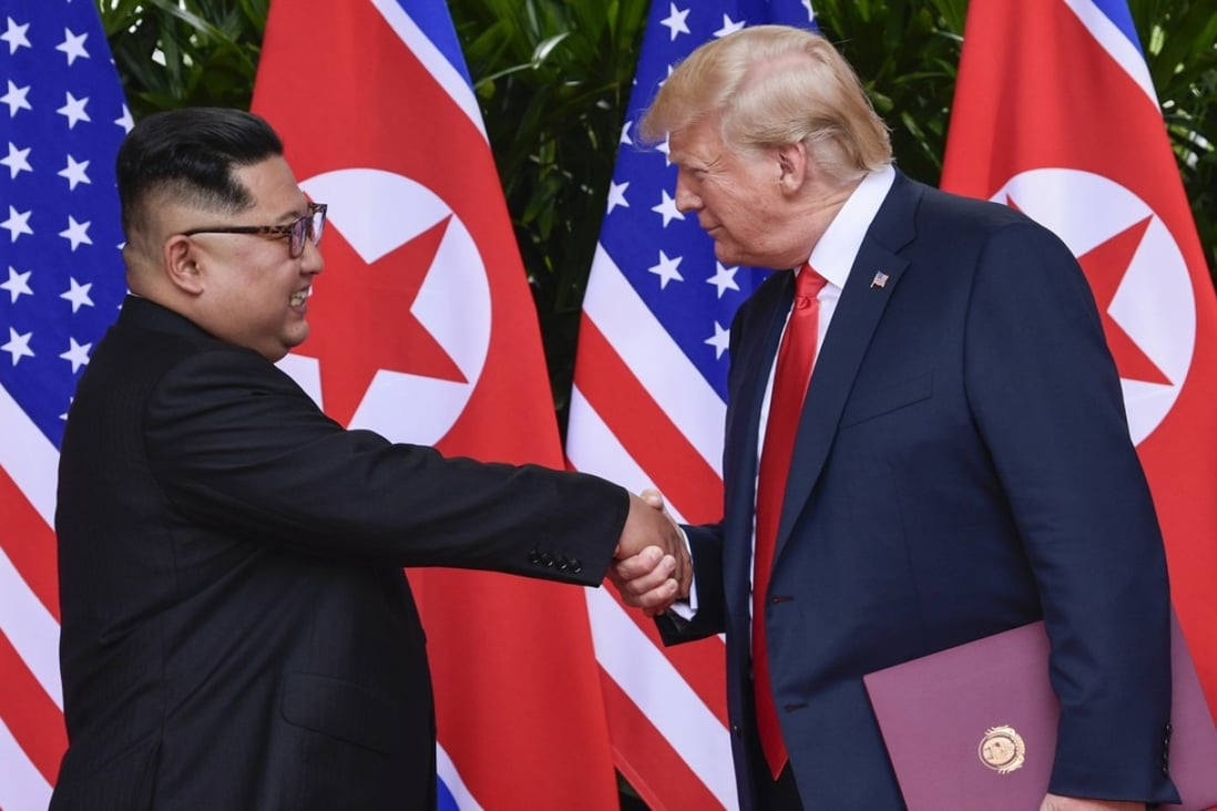 North Korean leader Kim Jong-un and US President Donald Trump shake hands at the conclusion of their meetings in Singapore on June 12. Photo: AP