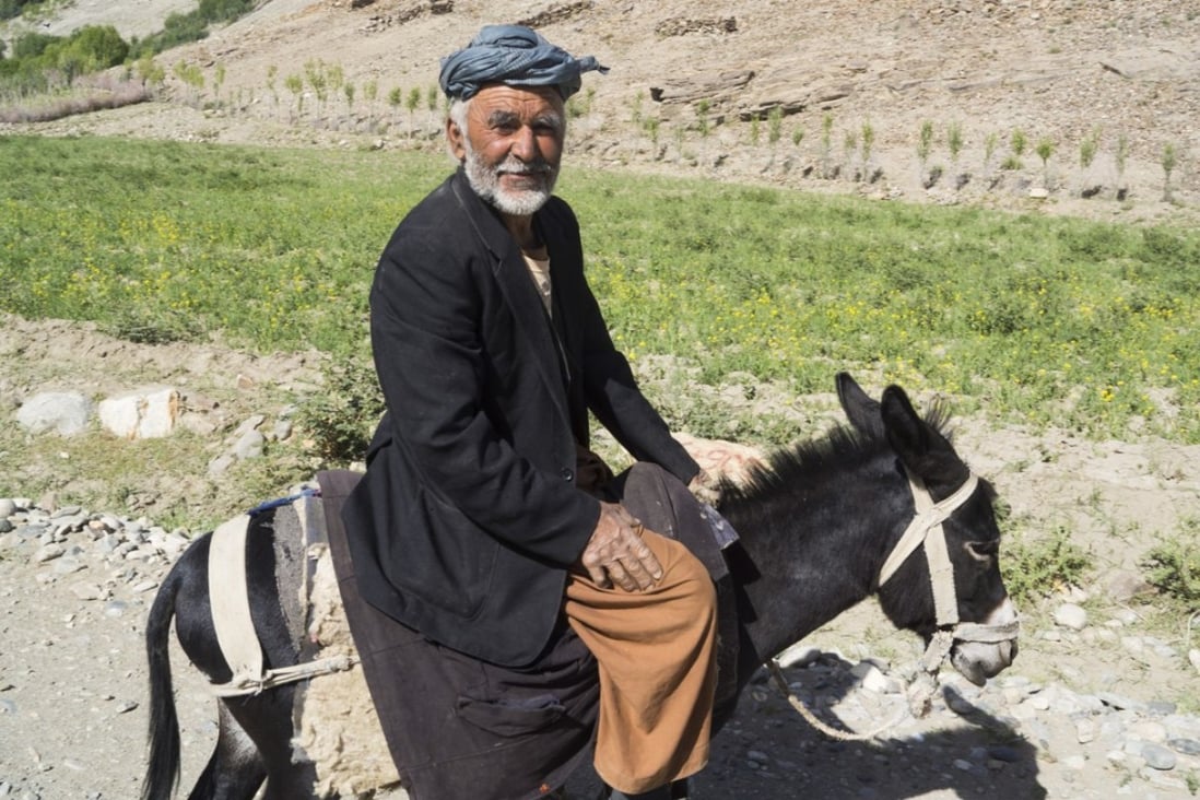 A local man on a donkey on the road between the Tajik border and Ishkashim. Photo: Edward Cavanough
