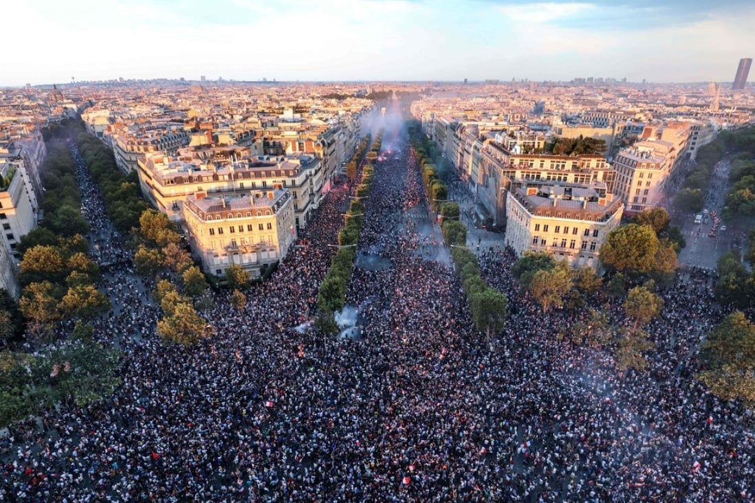 This picture taken from the top of the Arc de Triomphe on Sunday shows people gathering on the Champs-Elysees in Paris after France won the Russia 2018 World Cup final football match against Croatia. Photo: Agence France-Presse