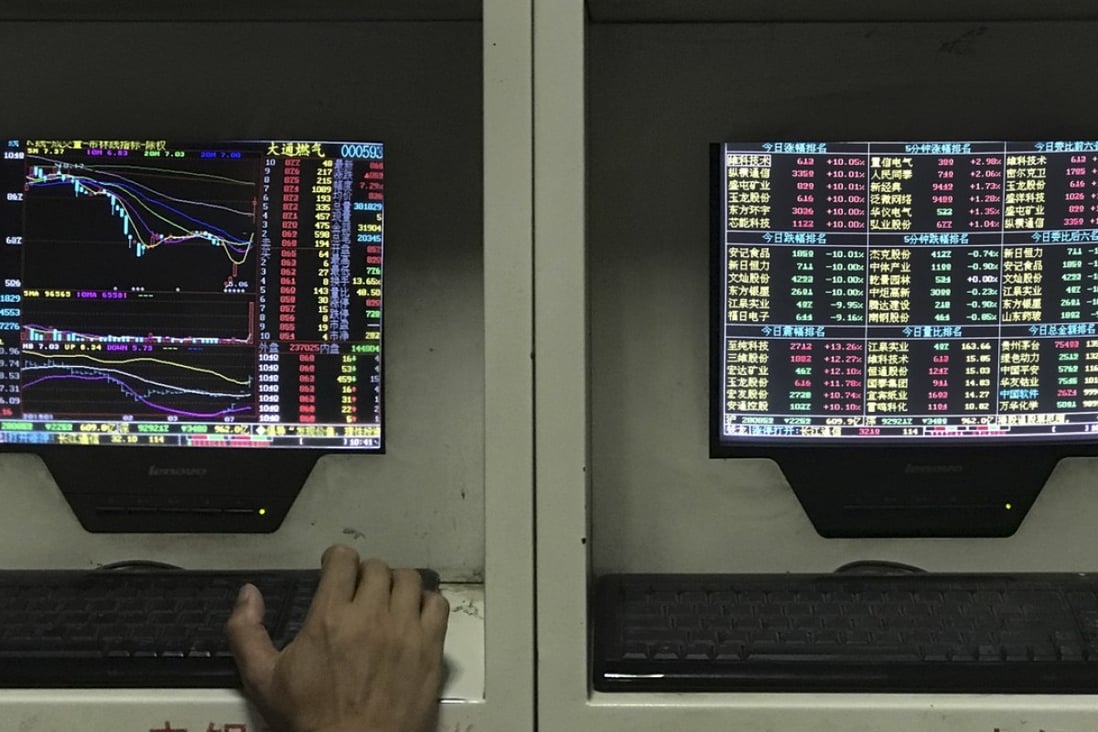 A man monitors stock prices at a brokerage house in Beijing. Photo: AP