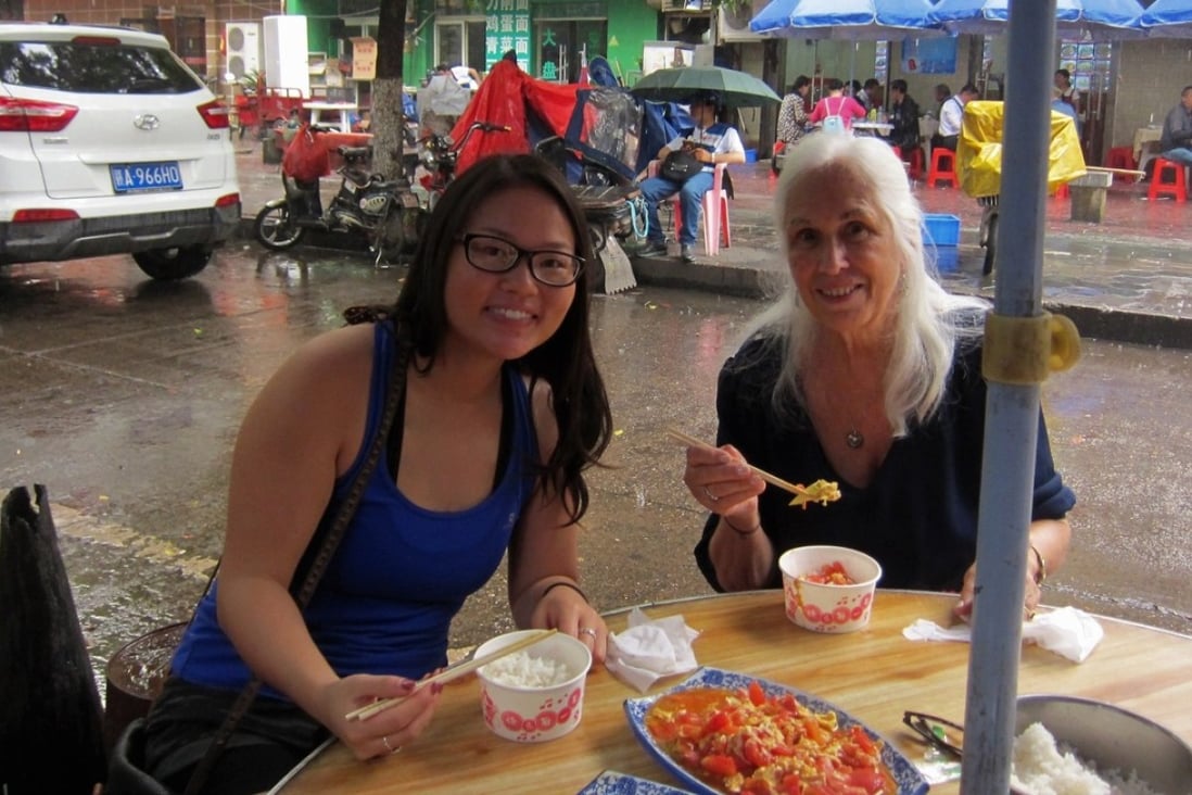 Kathryn Free (left) having lunch with her adoptive mother Carol at a Nanchang street food stall during their return to the city to search for Kathryn’s birth parents.