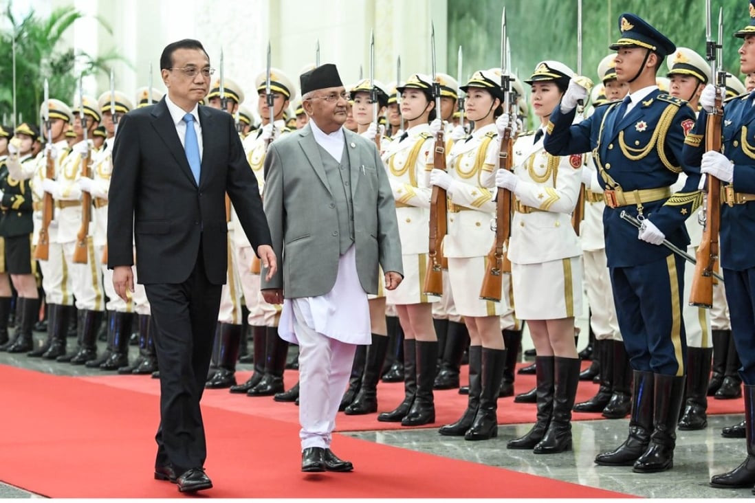 Chinese Premier Li Keqiang holds a welcoming ceremony for Nepal's Prime Minister Khadga Prasad Sharma Oli at the Great Hall of the People before their talks in Beijing. Photo: Xinhua