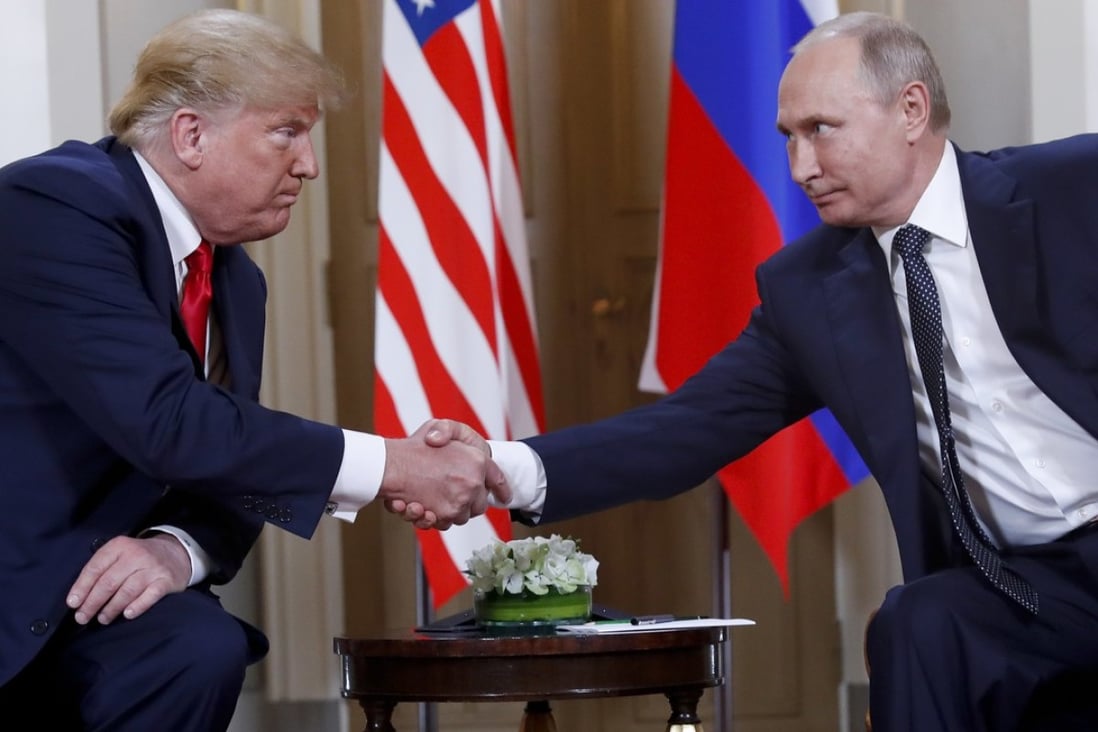 US President Donald Trump and Russian President Vladimir Putin shake hands on Monday. Trump has invited Putin to join him in the US, in a move that has startled the US president’s own staff. Phtoo: AP