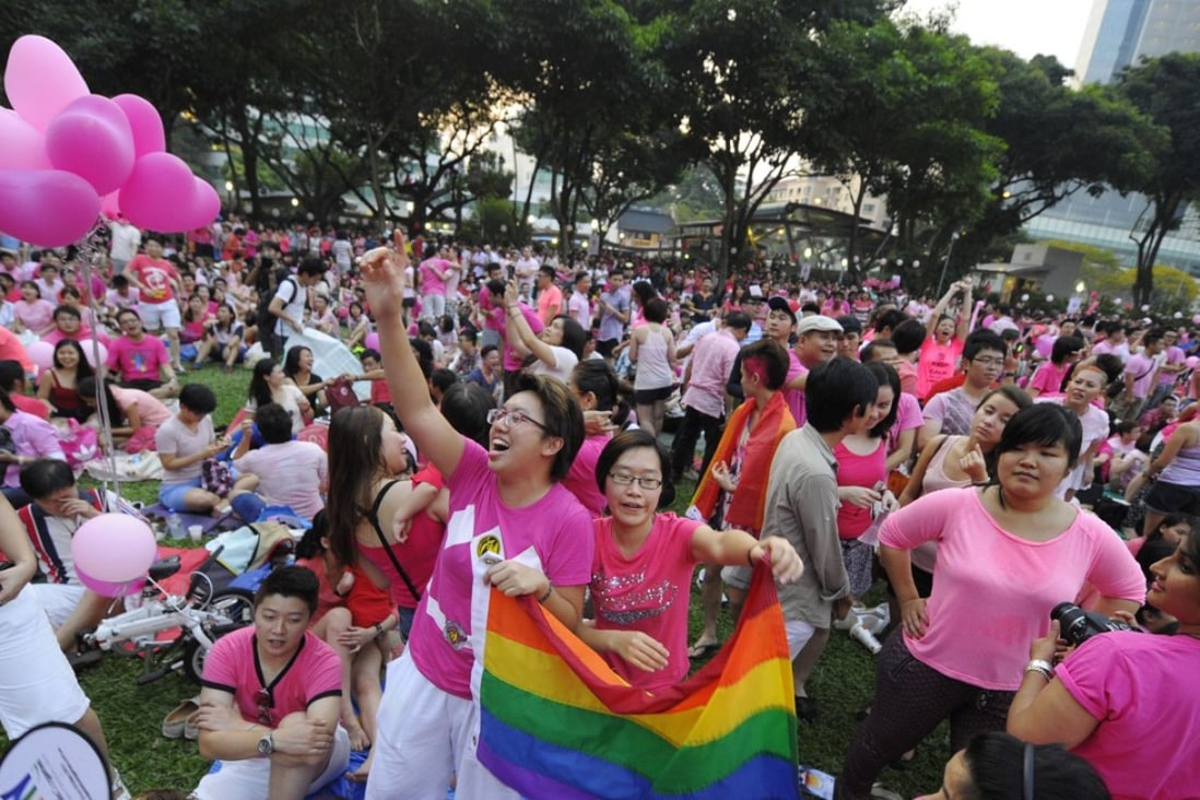 Two women cheer at a Pink Dot rally in support of gay rights in Singapore. Photo: AP
