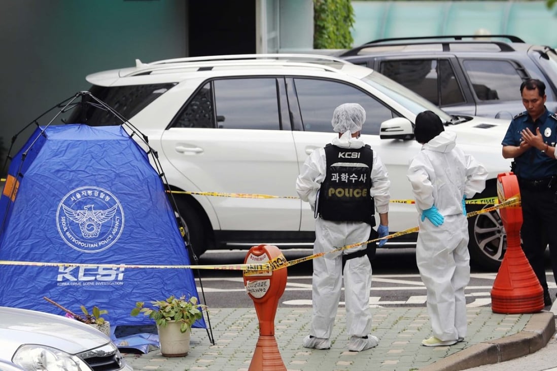 Police inspectors stand next to a tent set up at the spot where Roh Hoe-chan, a three-term lawmaker of South Korea's left-leaning Justice Party, was found dead. Photo: AFP