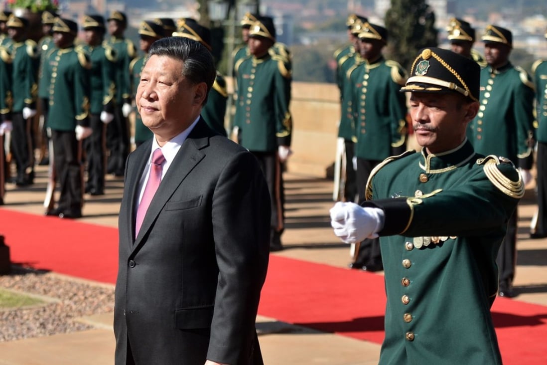 Chinese President Xi Jinping (left) inspects a military honour guard at the Union Building in Pretoria on Tuesday, during his state visit to South Africa. Photo: AFP