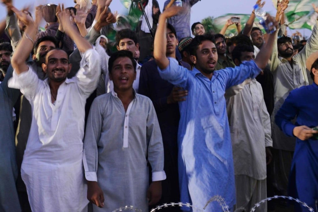 Supporters of Shahbaz Sharif, the younger brother of ousted Pakistani Prime Minister Nawaz Sharif, dance and cheer to songs during an election campaign rally in Pindi Gheb in Pakistan’s Punjab province. Photo: AFP
