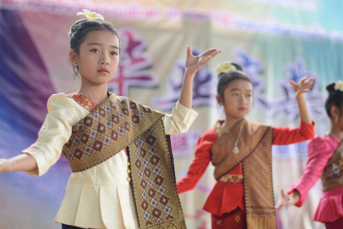 Girls dance at a graduation ceremony held at Mitthaphab School in Oudomxay Province, Laos. The school, founded in 2006, teaches both Chinese and Laotian. As China’s infrastructure spending in Southeast Asian nations grows, the US could ramp up its provision of education, health and finance services in the region. Photo: Xinhua