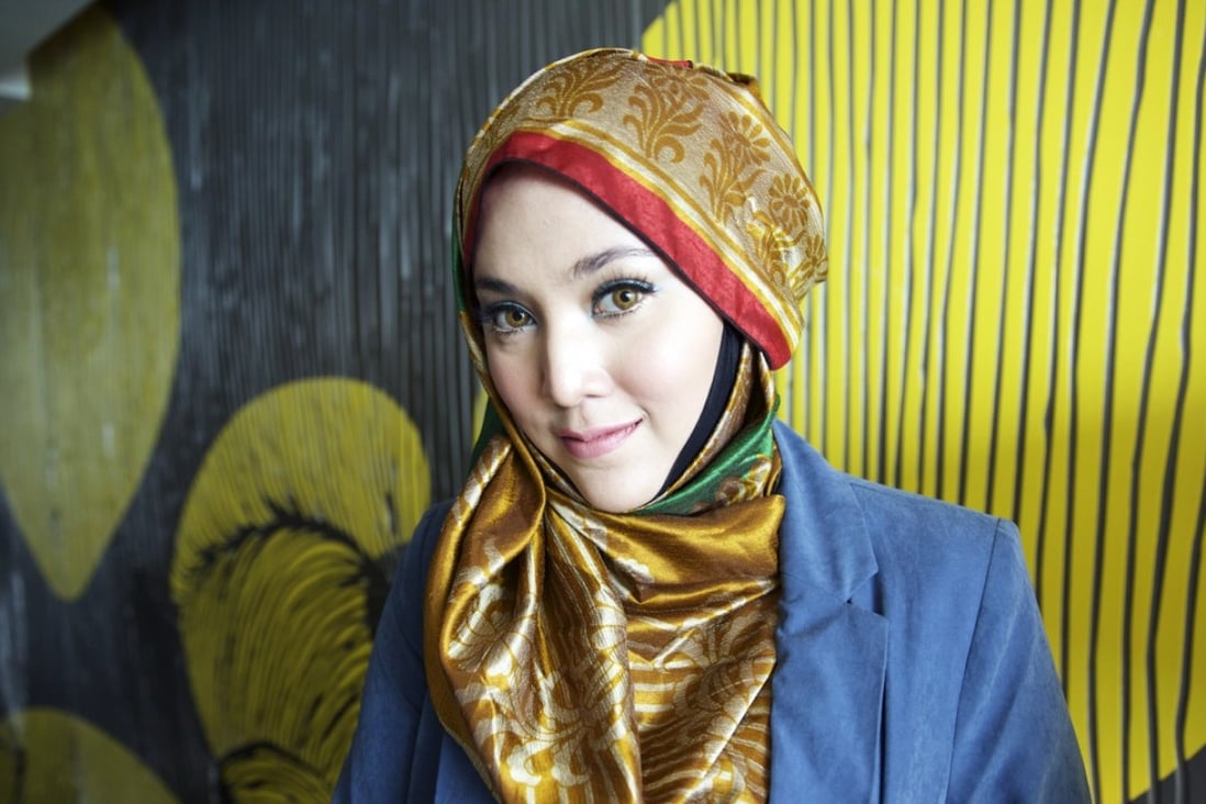 Shila Amzah is a fashion inspiration for millions of young Muslim women worldwide. Her colourful hijabs are a refreshing counterpoint to her international outlook. Photo: Vicky Feng