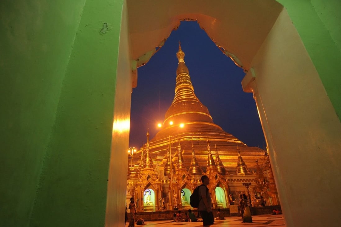 A tourist visits the Shwedagon Pagoda in Yangon. Photo: AFP