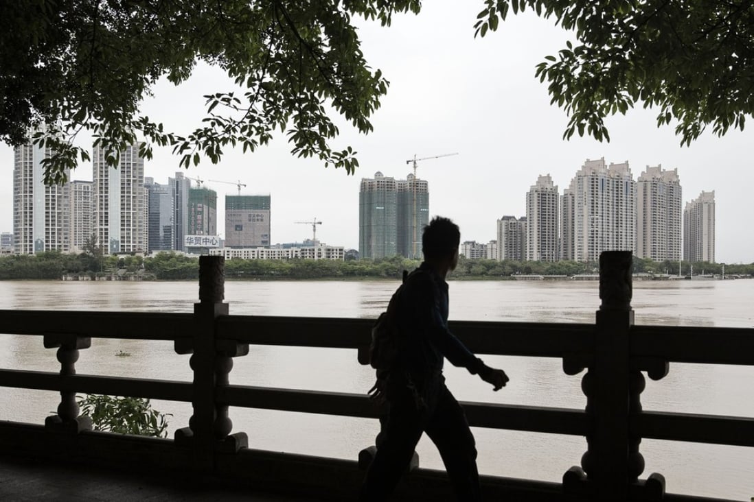 Mainland Chinese cities such as Guangzhou are likely to overtake Hong Kong in terms of house price appreciation in coming decade, says DBS. Photo: Bloomberg