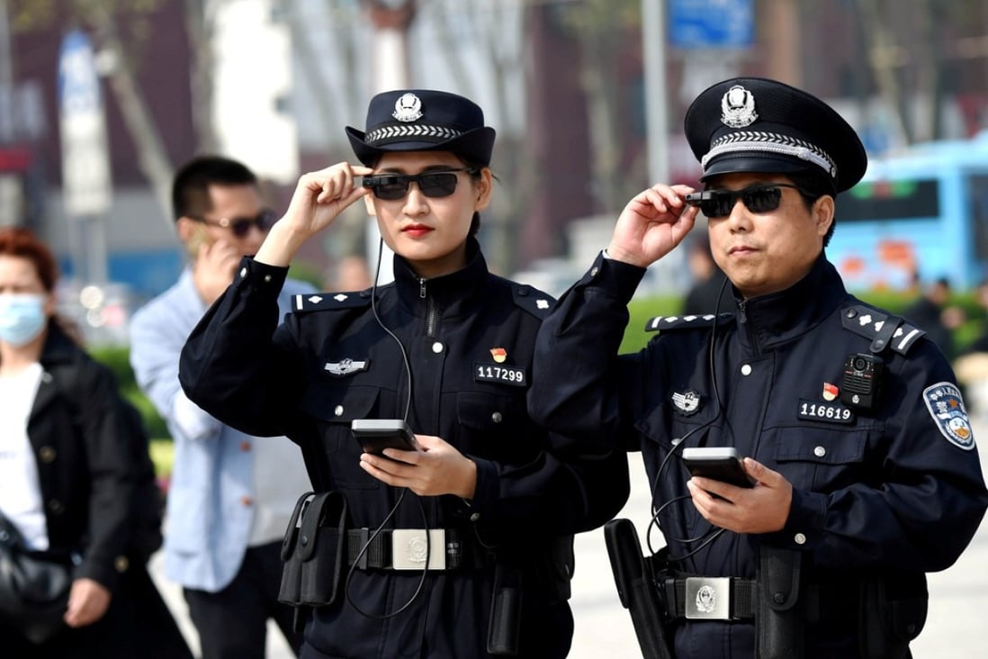 Police officers display their AI-powered smart glasses in Luoyang, Henan province. Photo: Reuters