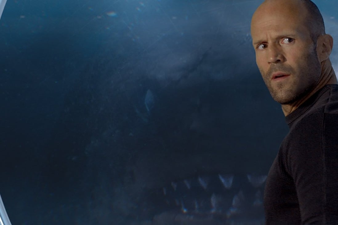 A prehistoric giant shark lines up Jason Statham as its next meal in The Meg. Photo: Courtesy of Warner Bros