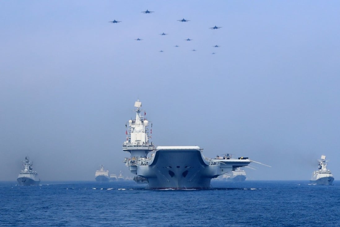 Warships and fighter jets of Chinese People's Liberation Army (PLA) Navy take part in a military display in the South China Sea April 12. File photo: Reuters
