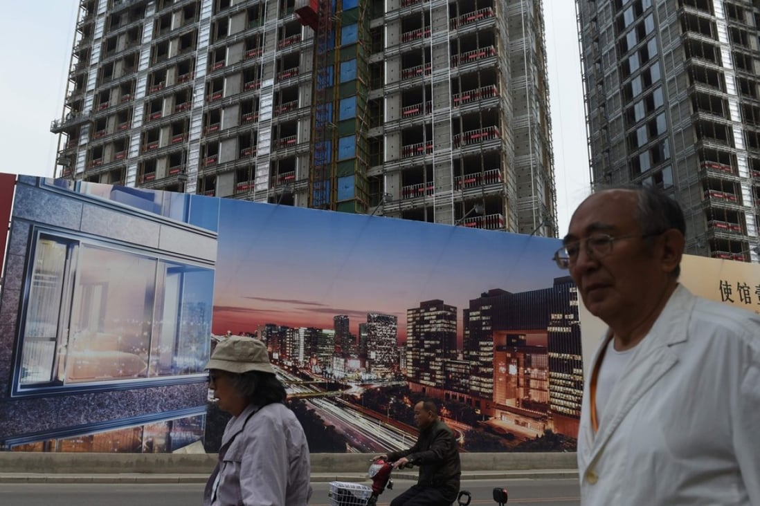 An advertisement for a new housing complex in Beijing. Chinese developers are facing rising complaints about safety and quality as they try to beat a business downturn by building properties as fast as they can. Photo: AFP