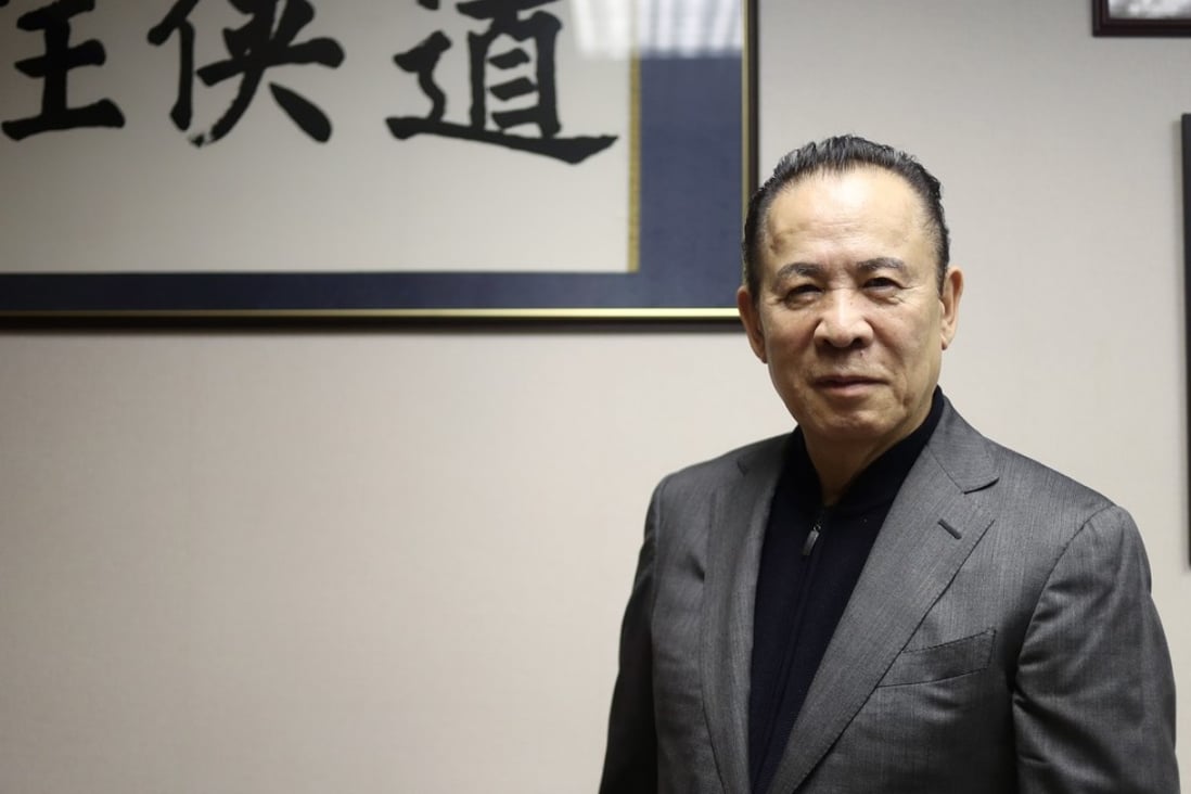 Kazuo Okada, former majority shareholder of Wynn Resorts, poses for a portrait in Central. Photo: Winson Wong