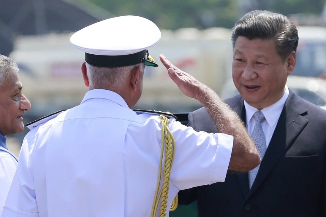 An Indian naval officer salutes Chinese President Xi Jinping upon his arrival in Goa, India in October 2016. Unlike at the land border between them, China and India’s interactions at sea have not been tense thus far, but this may not last. Photo: AP