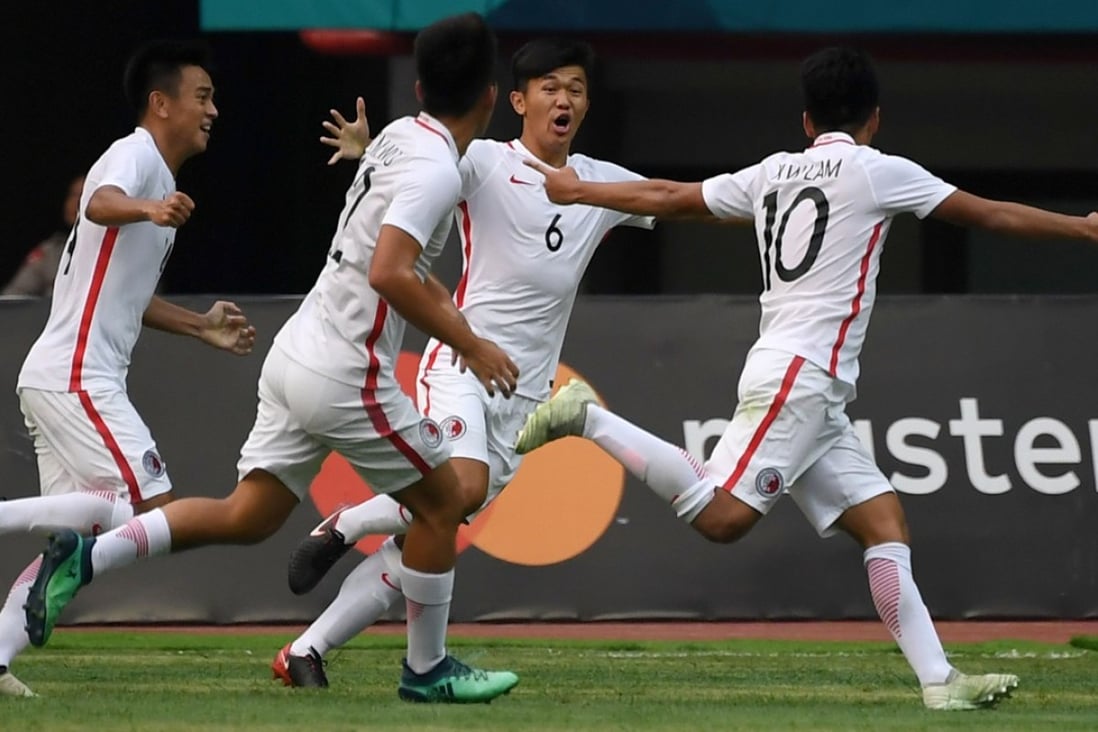 Lam Ka-wai of Hong Kong (right) celebrates after scoring a goal against Palestine at the Asian Games. Photo: AFP