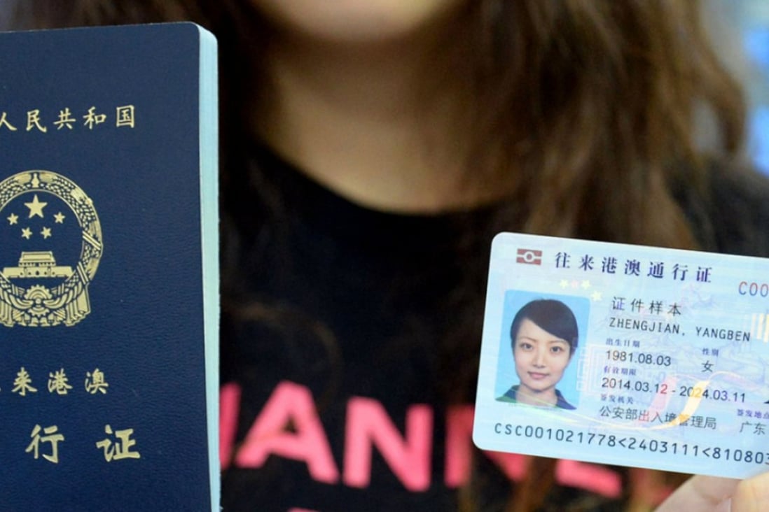A model displays a Chinese passport and mainland ID card, similar to the one that will be issued to residents of Hong Kong, Macau and Taiwan. Photo: Weibo