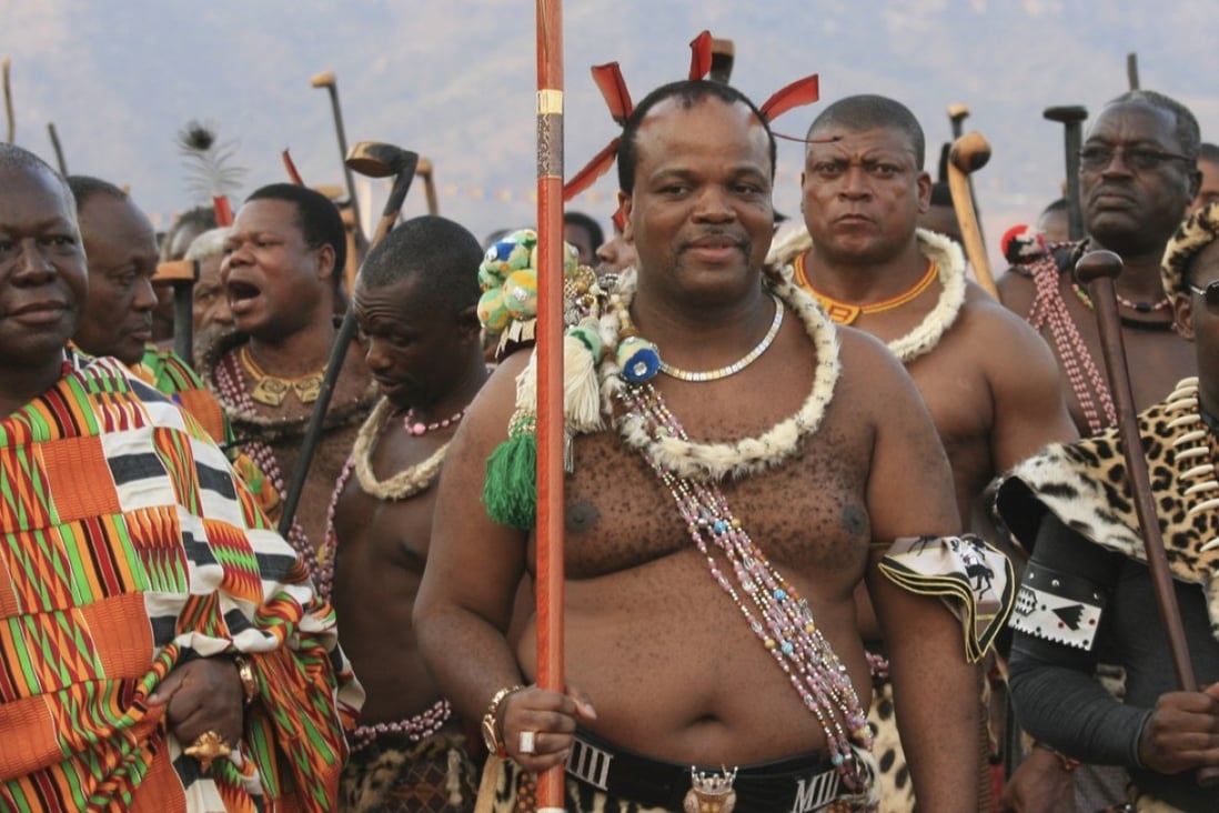 King Mswati III (centre) flanked by his entourage and security guards. Photo: Post Magazine