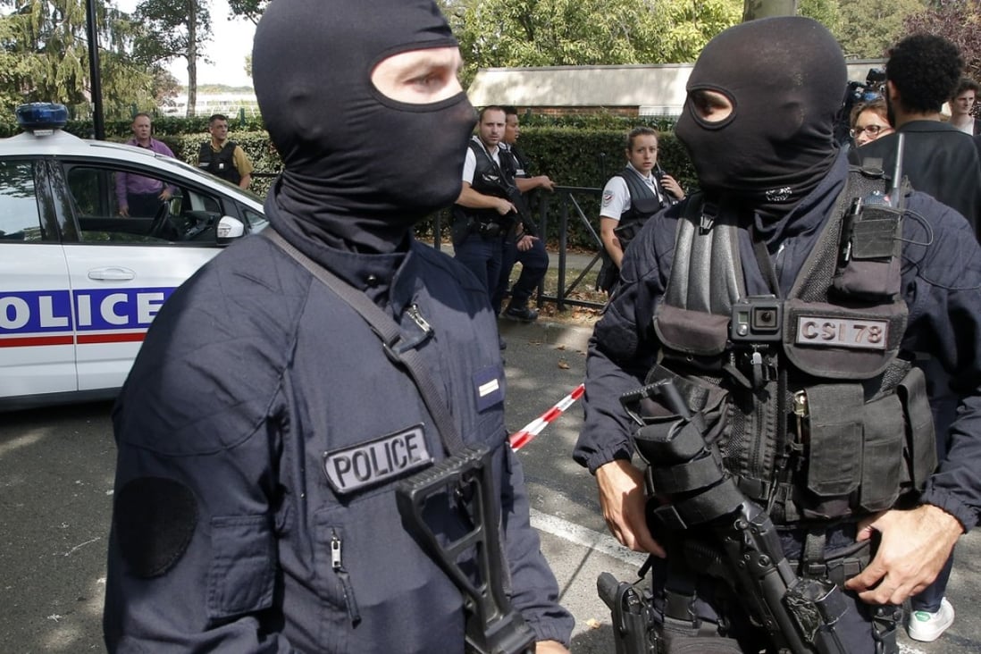 Police at the scene of the knife attack in Trappes, west of Paris. Photo: AP