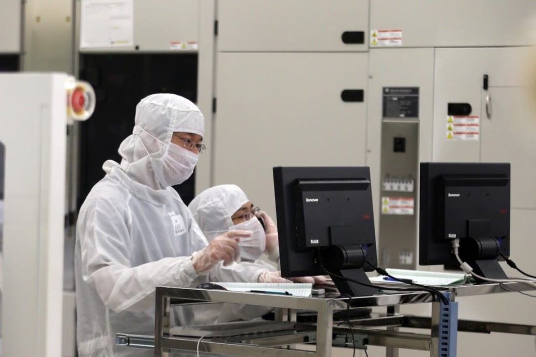 Chinese employees dressed in dustproof clothing work at a wafer fabrication plant in Beijing. China’s is moving to develop a strong domestic semiconductor supply chain, which would enable the country to become more competitive with chip industry leader the United States. Photo: Imaginechina