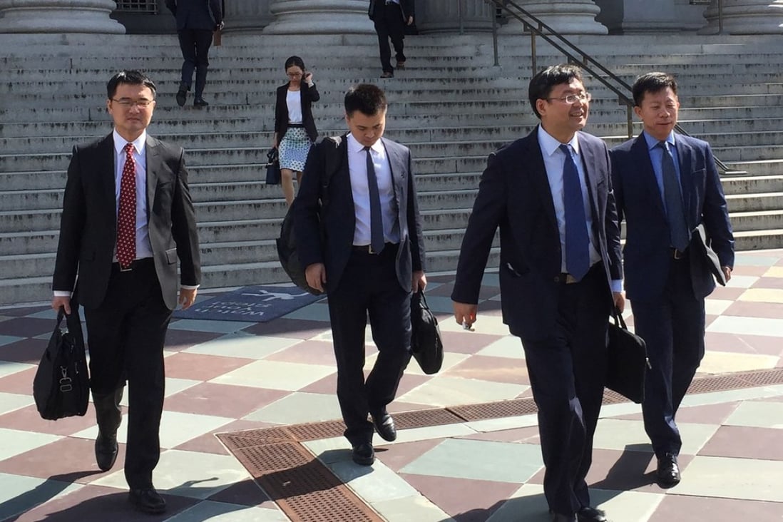 Members of a Chinese Trade delegation leave the US Treasury building after two days of talks with US representatives in Washington on Thursday. Photo: AFP