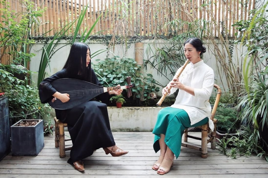 Sissy Han (right), owner of the Rong Gallery Inn in Quanzhou, takes part in a recital of traditional music. The inn is one of a new wave of smaller budget properties in China that are transforming the country’s tourism landscape.
