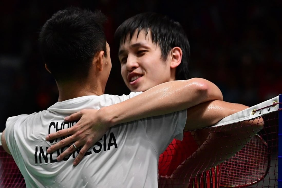 Hong Kong’s Vincent Wong (right) embraces Indonesia’s Jonatan Christie after his defeat. Photo: AFPs