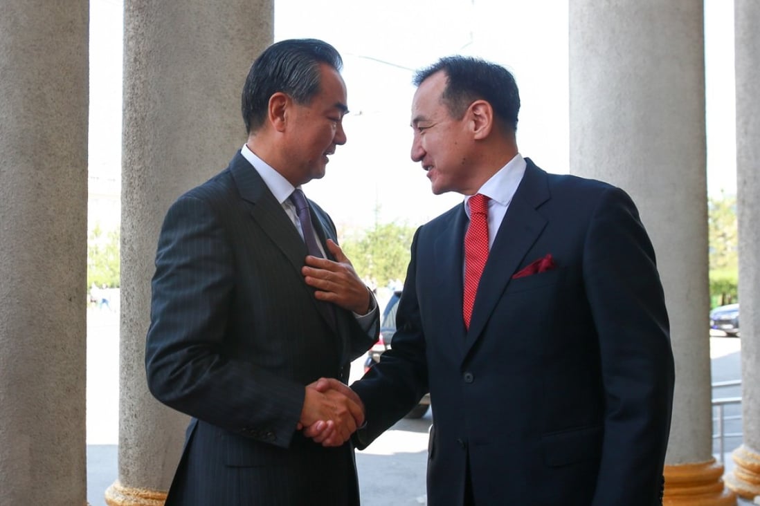 Chinese Foreign Minister Wang Yi (left) meets Mongolian Foreign Minister Damdin Tsogtbaatar at the Mongolian Foreign Ministry in Ulan Bator, Mongolia, on Thursday. Photo: EPA-EFE