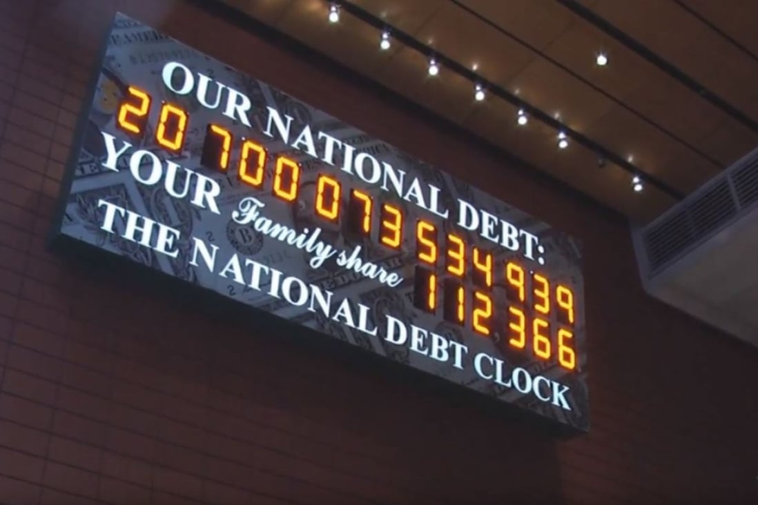 A billboard with a ticker keeps track of the US national debt. Photo: YouTube