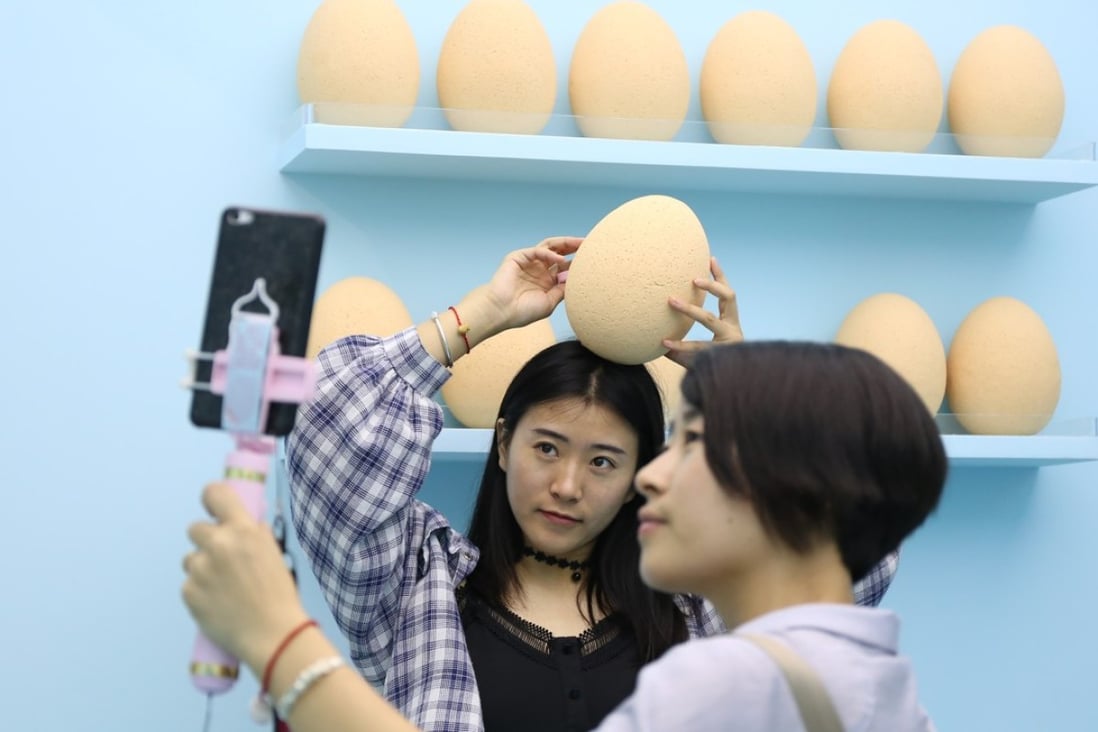 Visitors to The Egg House in Shanghai, a pop-up egg-themed exhibition founded by Xu Biubiu. Photo: Rachel Cheung