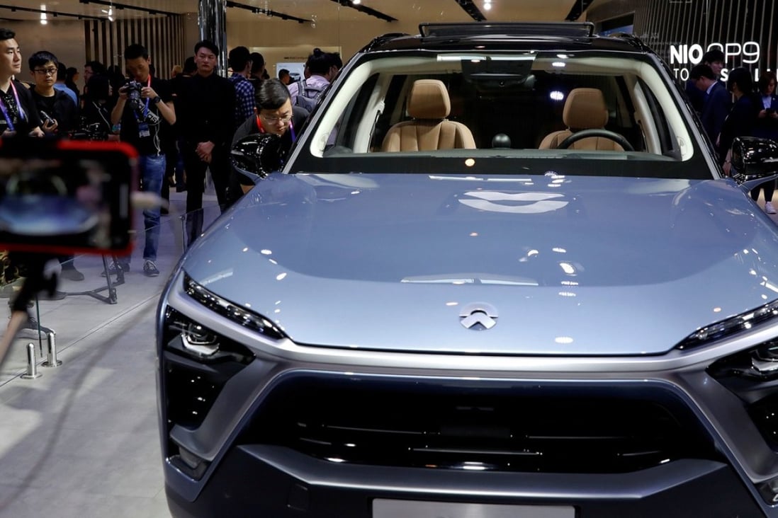 Car enthusiasts check out the NIO ES8 during a media preview of the Auto China 2018 motor show in Beijing on April 25, 2018. Photo: Reuters