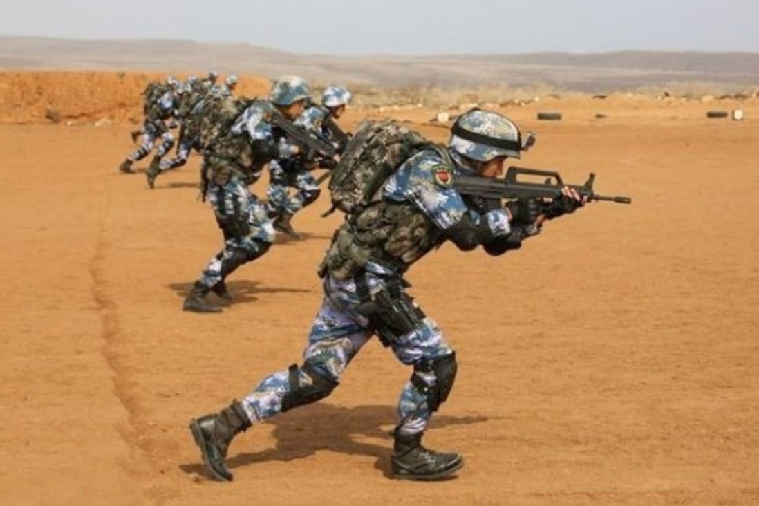 Chinese troops based at China’s first overseas military base in Djibouti take part in a live-fire drill last year. The Afghan embassy said no Chinese military personnel would be stationed in Afghanistan. Photo: Handout