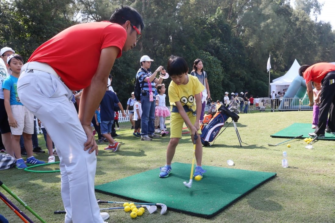 Children receive golfing tips at the Hong Kong Golf Club in Fanling, in October 2015. Photo: K.Y. Cheng