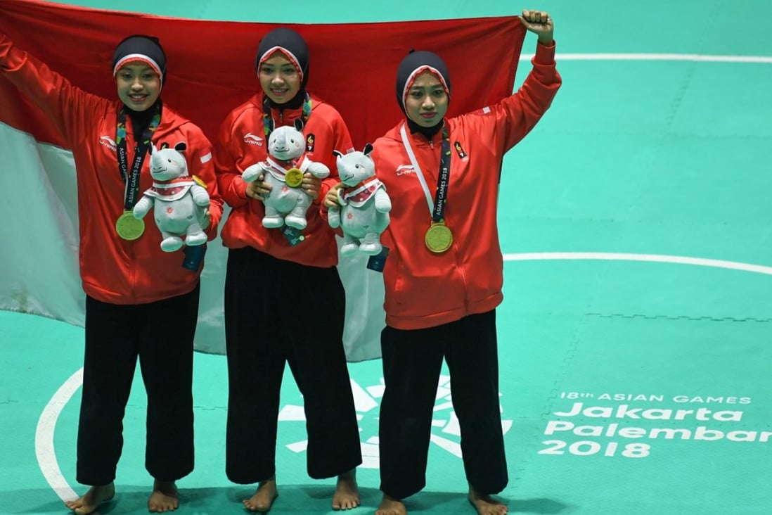 Indonesia's victorious women’s team, one of 14 golds they won in pencak silat. Photo: Xinhua