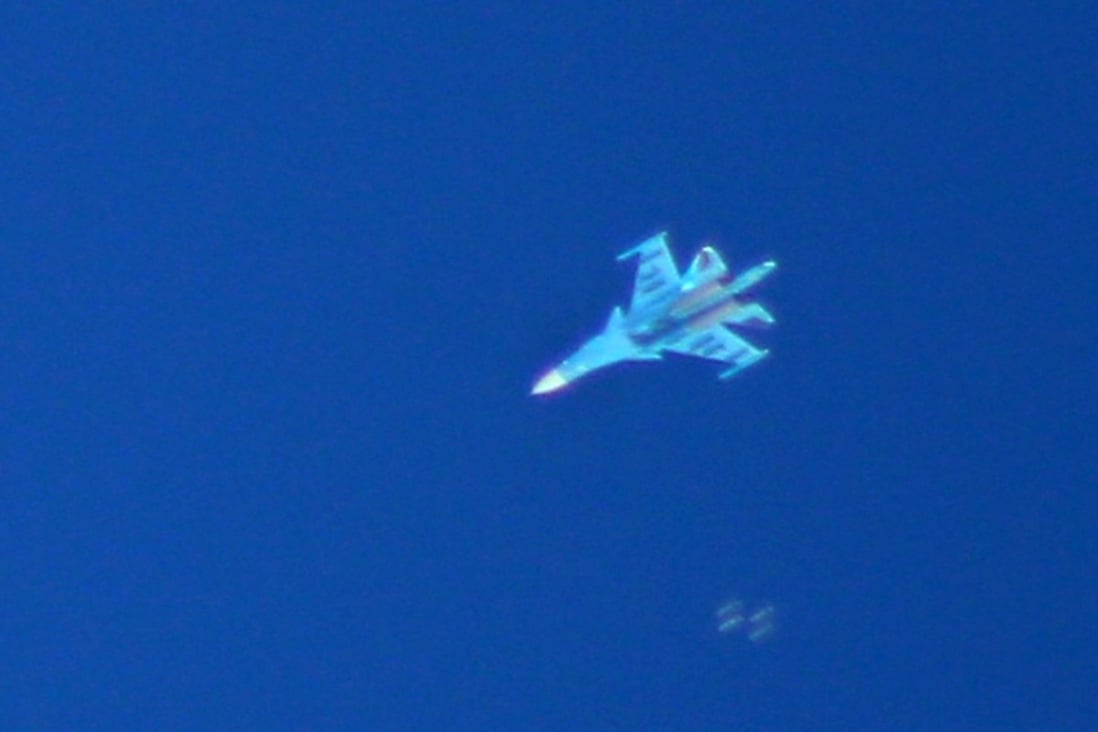 A Russian Sukhoi Su-34 fighter drops bombs above the Syrian village of Kafr Ain in the southern countryside of Idlib province Photo: AFP