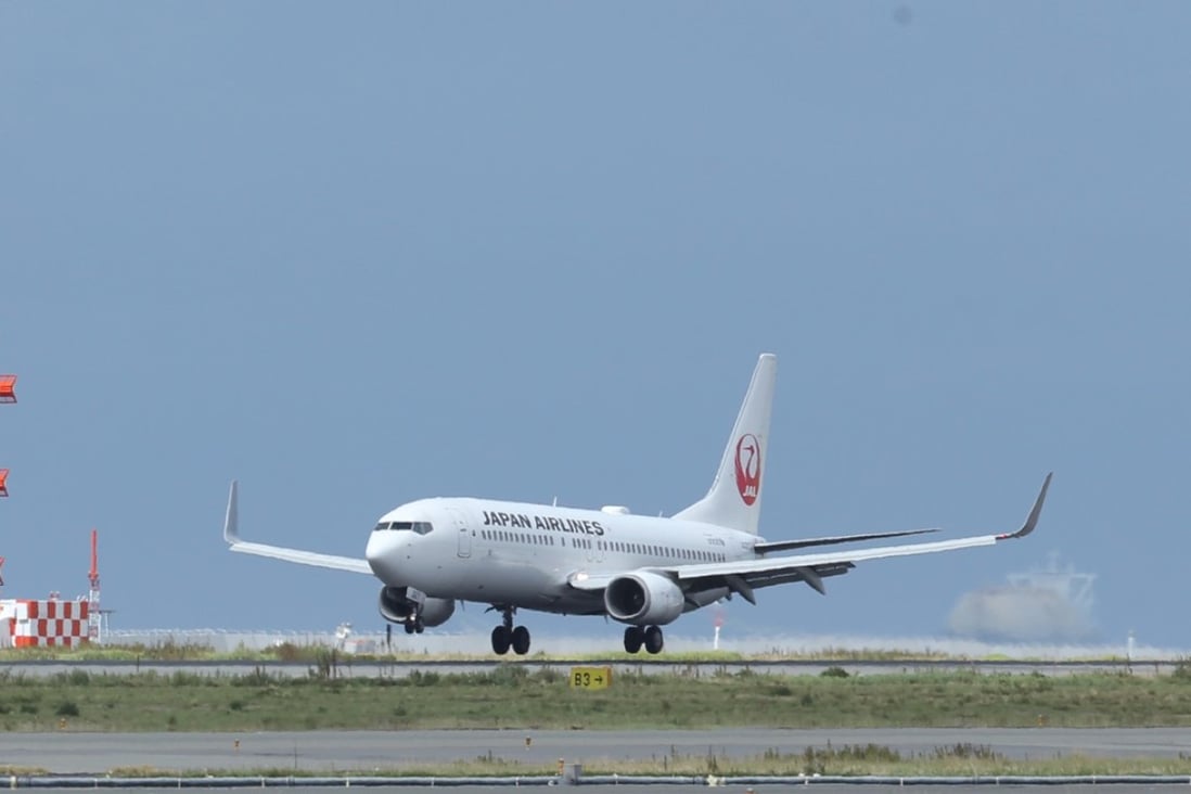 A passenger aircraft operated by Japan Airlines lands at Kansai International Airport. Photo: Bloomberg