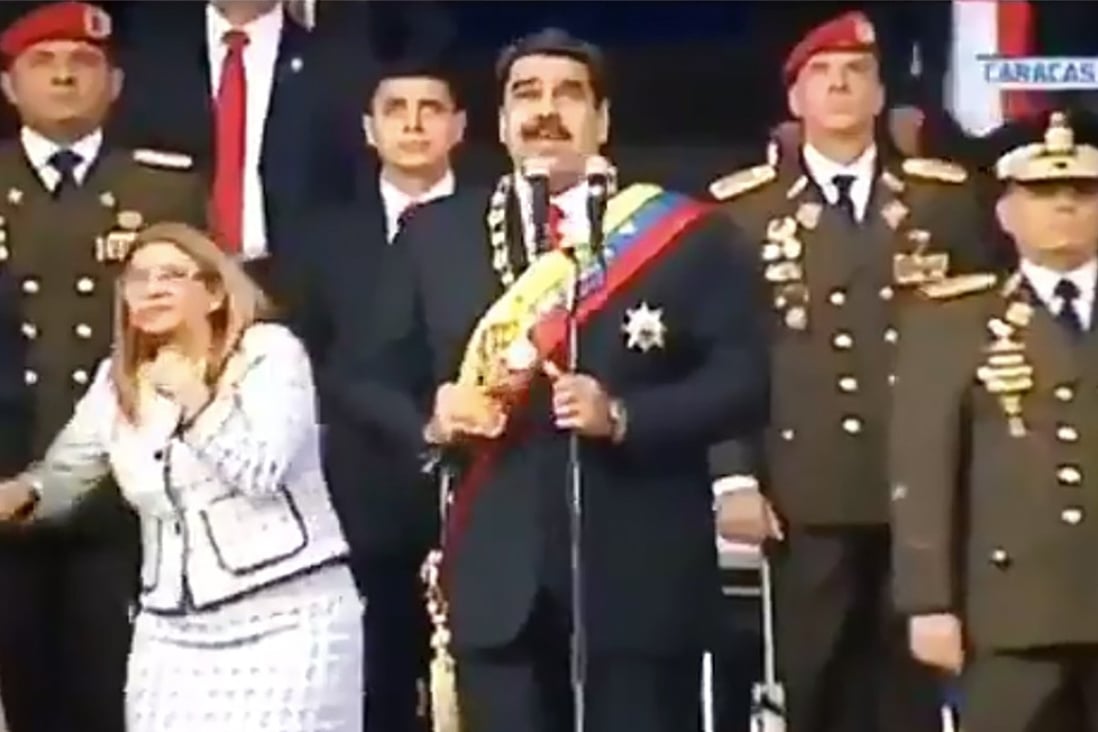 Venezuelan President Nicolas Maduro (C), his wife, Cilia Flores, left, and military officers reacting to a loud bang at a ceremony on August 4. Officials from US President Donald Trump's administration met secretly with Venezuelan military officers to discuss plans to oust Maduro but reportedly decided not to help. Photo: AFP