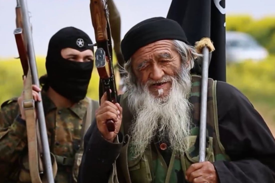 Muhammed Amin, 80-year-old Islamic State fighter, and reportedly a member of China’s Uygur minority, is seen with another IS member in Syria, in this image from a 2015 propaganda video. Photo: Handout