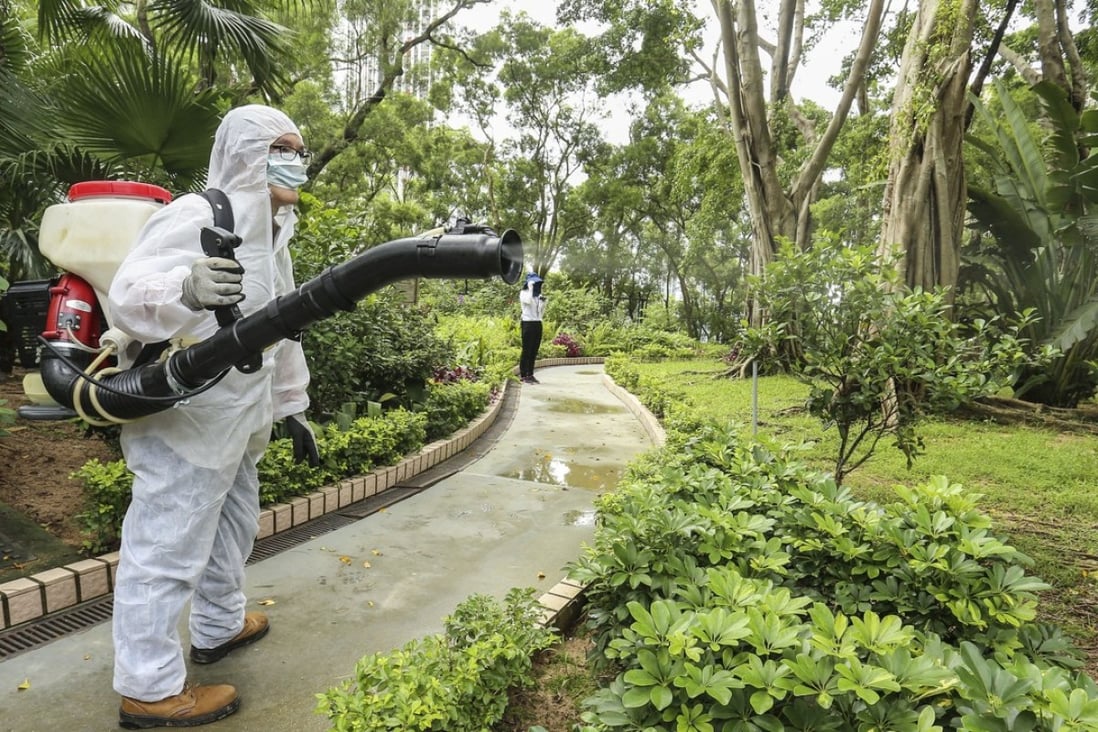 A worker sprays insecticide to exterminate mosquitoes at the Lion Rock Park in Wong Tai Sin on August 18. A number of people suffering from dengue fever had visited the park. Photo: Dickson Lee