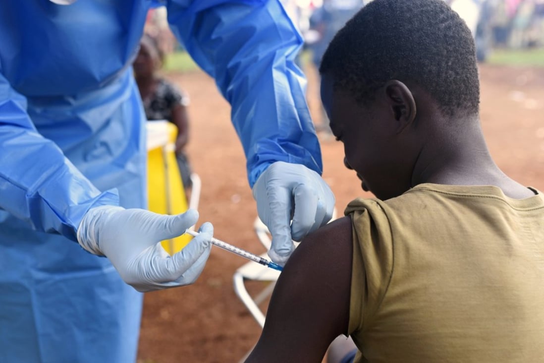 A Congolese health worker administers Ebola vaccine to a boy who had contact with an Ebola sufferer in the village of Mangina in North Kivu province of the Democratic Republic of Congo. Photo: Reuters/Olivia Acland