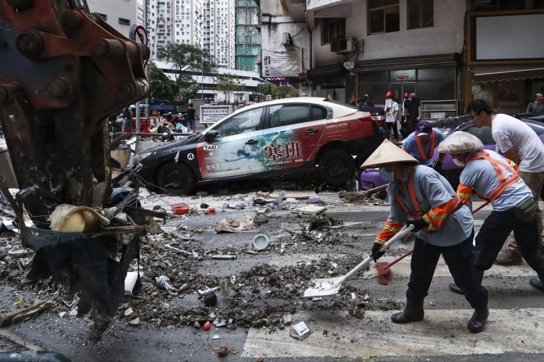 Macau residents clear up after the devastation caused by Super Typhoon Hato last year. Photo: Nora Tam