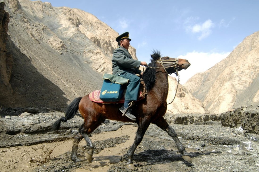 A postman undertakes the lonely job of delivering mail in the Pamir Mountains, serving more than 5,000 nomads scattered around the remote western region of China, in March 2012. Photo: Xinhua 