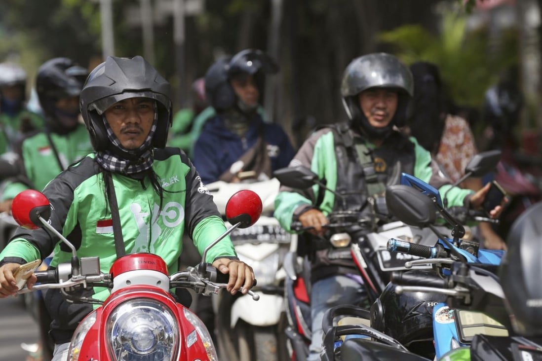 Go-jek drivers wait for customers in Jakarta, Indonesia, 2018. Photo: AP