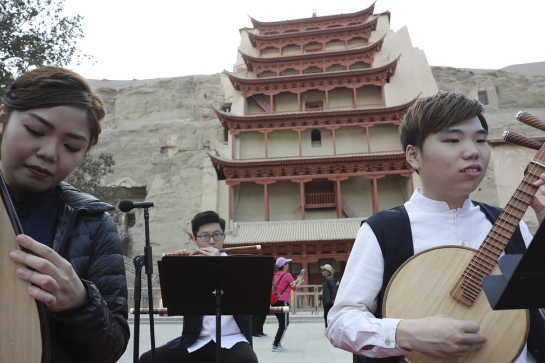 Musicians of the Gaudeamus Dunhuang Ensemble from Hong Kong rehearse before a performance in front of the Nine-Storey Pagoda at the Mogao Caves of music inspired by the ancient grottoes’ Buddhist art and artefacts. Photo: Simon Song