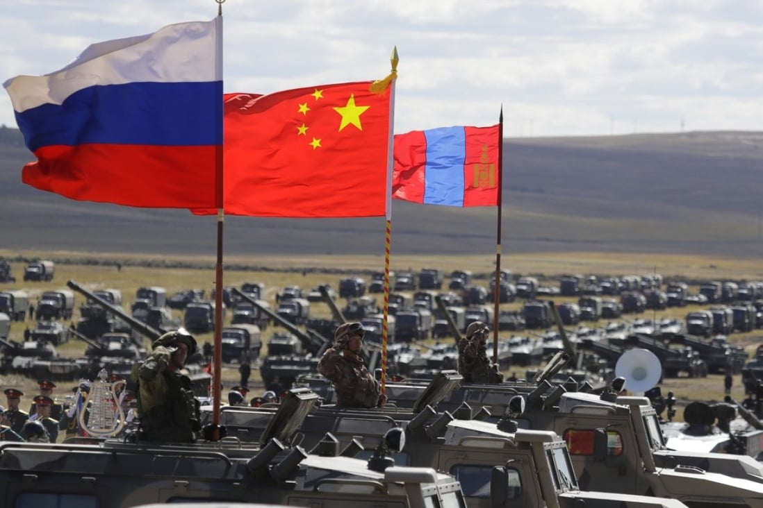 Russian, Chinese and Mongolian national flags are set on armoured vehicles during the Vostok 2018 military exercises in Eastern Siberia, Russia, on September 13. Photo: AP