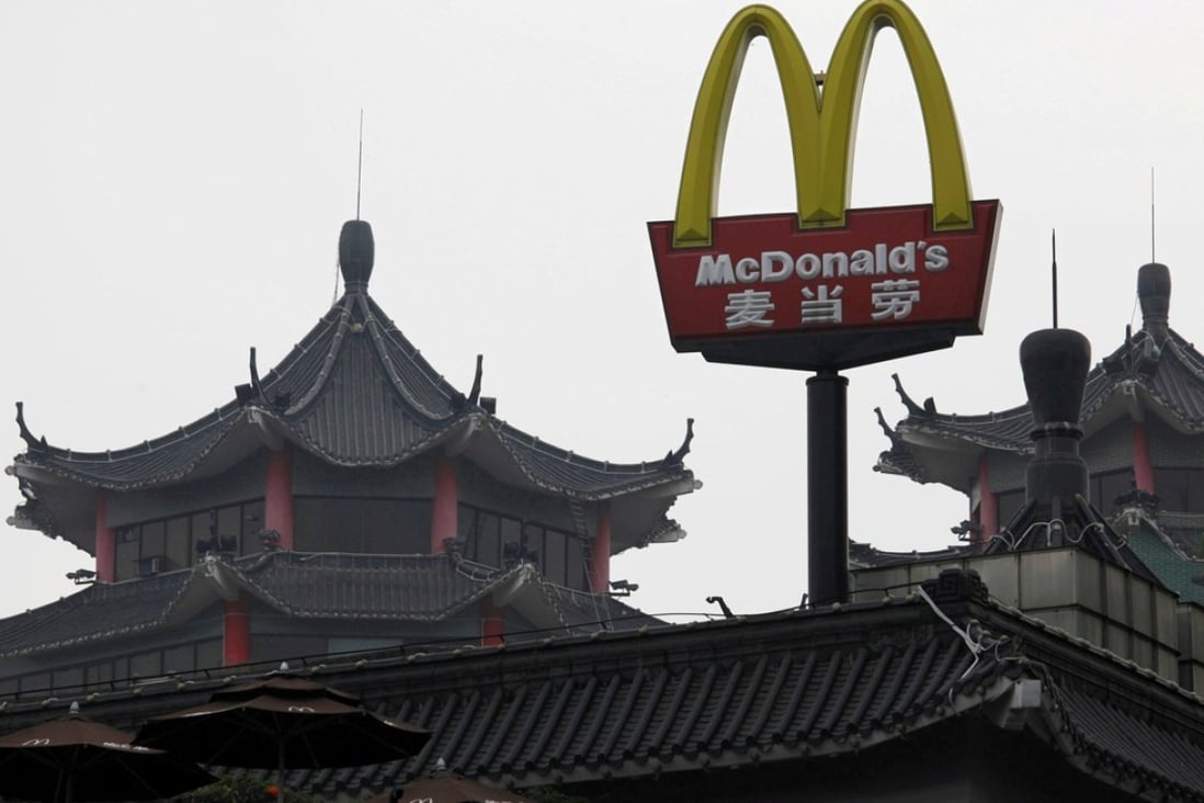A McDonald’s sign is displayed outside an outlet in Shenzhen in March 2013. The store, which opened its doors in 1990, was the first McDonald’s restaurant in China. Photo: Reuters